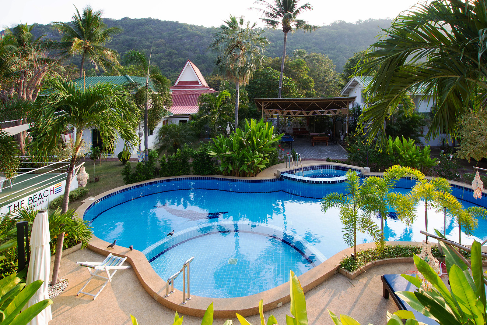 "Outdoor pool at an addiction treatment center in Thailand, offering a serene environment for recovery."