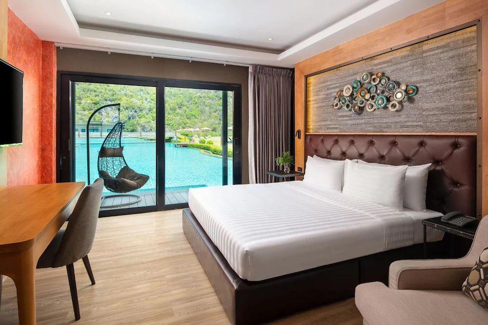 "Spacious, comfortable room at Tao Rehab Thailand with serene garden views."